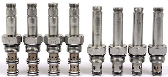 Cartridge valves showing guide tube deformation from improper torque